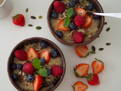 A bowl of oatmeal topped with fresh berries
